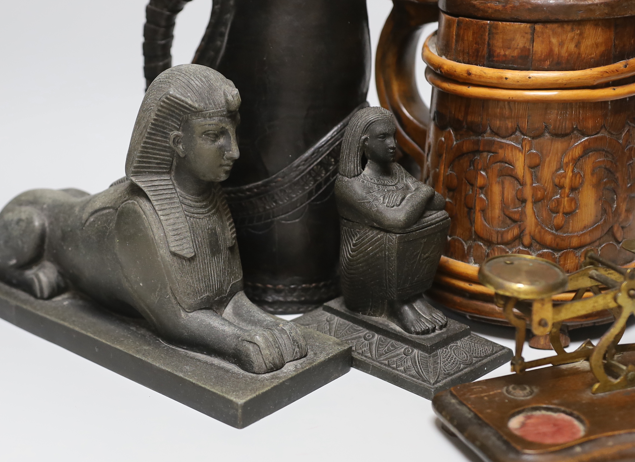 A group of collectables to include a blackjack, postal scales, Egyptian style figures etc. tallest 23cm